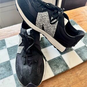 New balance- Black and White Sneakers with animal print “N”. Kids Size 7.